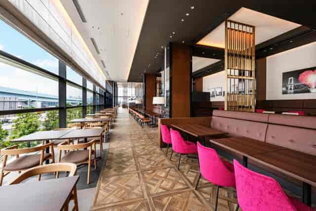 Modern hotel event space in Tokyo with floor-to-ceiling windows for meetings and conferences.