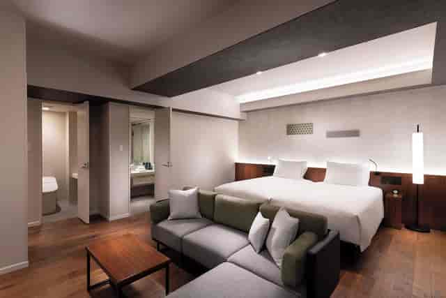 Modern DoubleTree Tokyo Ariake executive meeting room with minimalist lounge for corporate events.