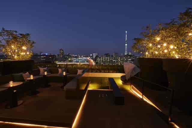 Rooftop bar with skyline views, perfect for exclusive networking receptions and VIP cocktail events.