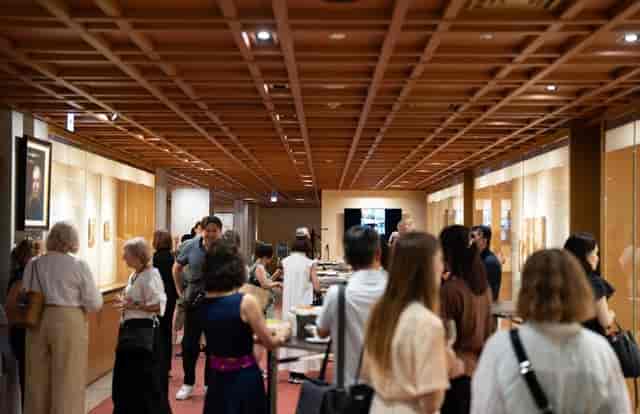 Networking reception at Tokyo American Club with sophisticated gallery-style event layout.
