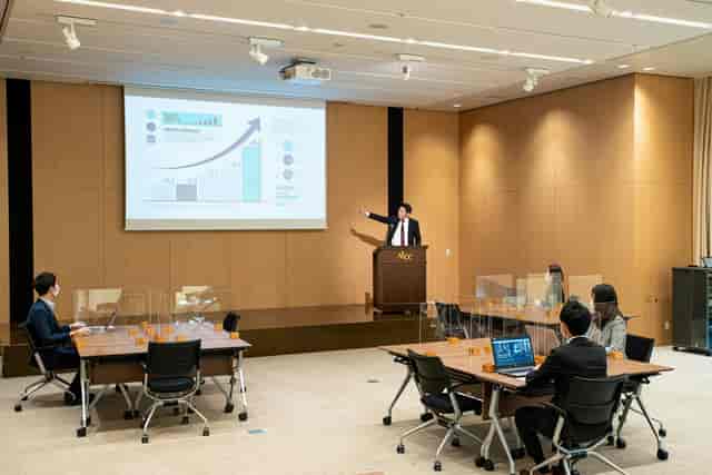 Corporate seminar at Akasaka Intercity Conference Center with classroom AV setup.