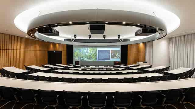Akasaka Intercity Amphitheater: tiered classroom seating for corporate conference presentations.