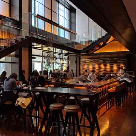 Upscale NAMIKI667 restaurant with architectural lighting for professional networking and cocktails.