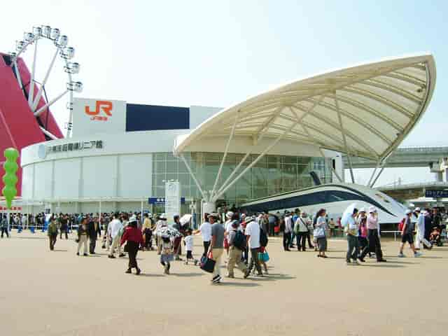 Conference Tower with dramatic canopy architecture at Tourism EXPO Japan event venue.