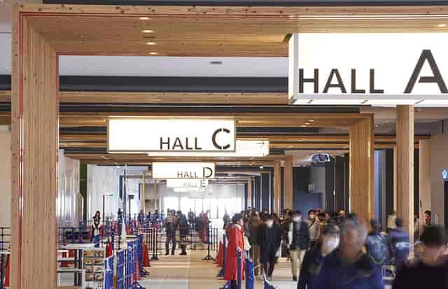 Tourism EXPO Japan exhibition hall, wooden architecture, trade show event, convention center.