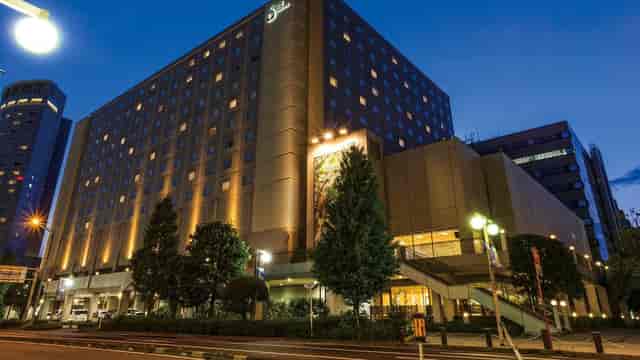 Oriental Hotel Tokyo Bay banquet hall at dusk for corporate conferences and professional events.