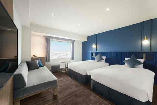 Modern twin guest room at Oriental Hotel Tokyo Bay for corporate events and business travel.