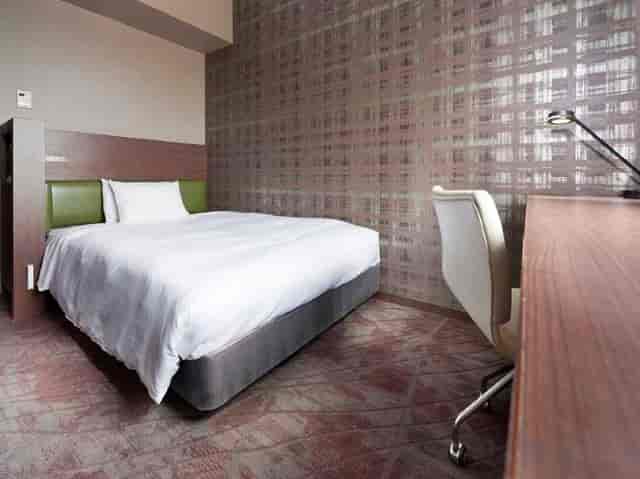 Modern conference room with dedicated workspace for business travelers and corporate events.