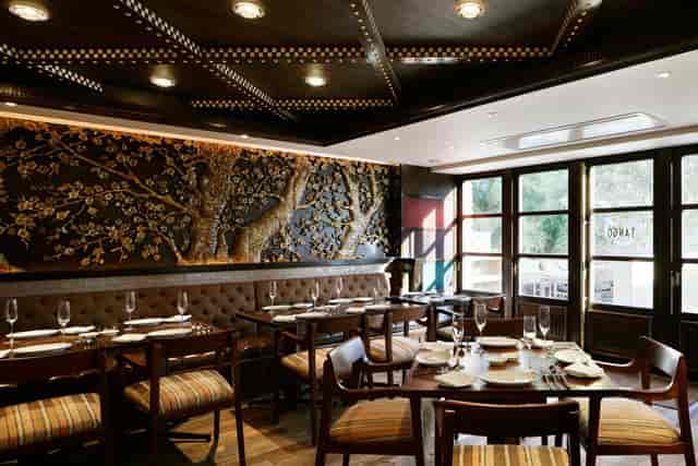 Sophisticated private dining banquet hall with textured wall for corporate events and luncheons.