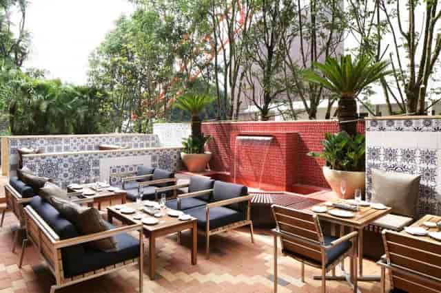 TANGO terrace: lounge seating by water feature for outdoor cocktail receptions and networking.