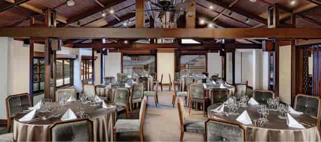 Rustic-chic banquet hall with timber beams in Kyoto, ideal for corporate events and weddings.