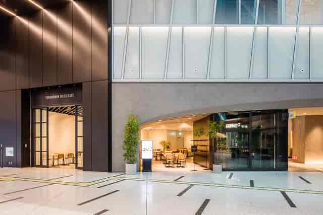 Modern Hills Café entrance at Roppongi Hills Arena, ideal for conference networking and events.