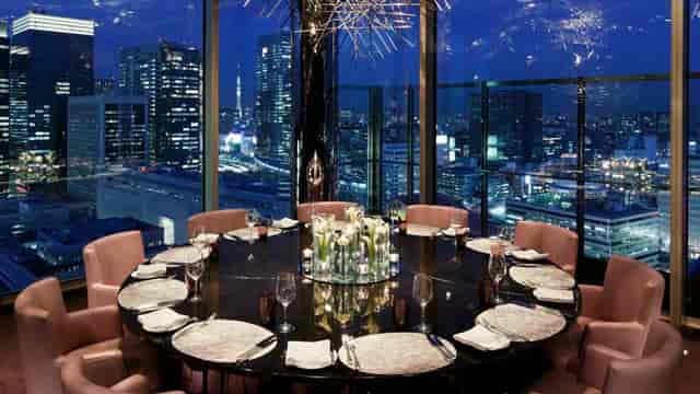 Private dining room with city skyline view for executive business dinners and VIP events.