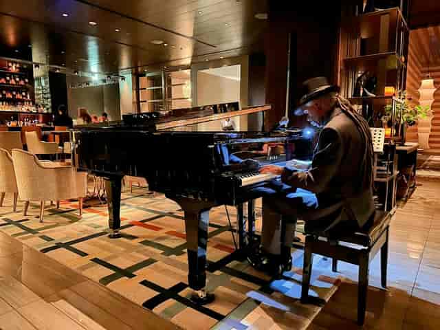 Sophisticated lounge networking event with ambient lighting and live entertainment.