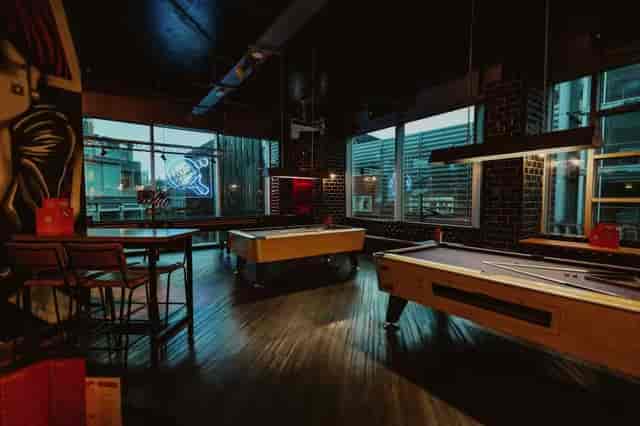 Stylish event space with billiard tables for networking and social gatherings in Liverpool.