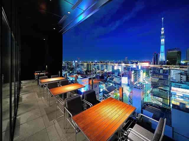 Rooftop sky bar with skyline view for premium cocktail hours and VIP networking events.