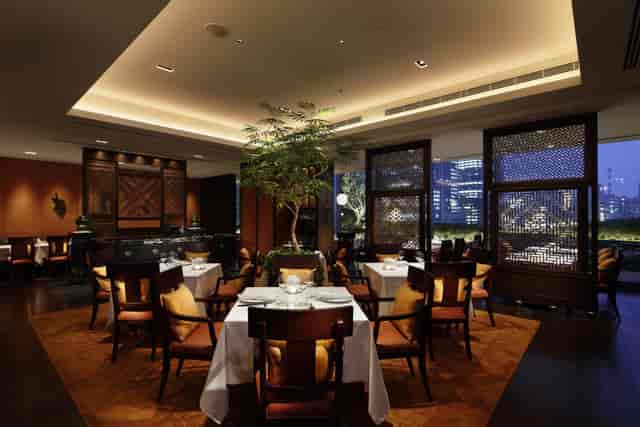 Esterre private dining room with city skyline view, ideal for luxury corporate and VIP events.