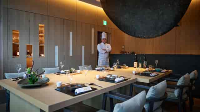 Upscale private dining room with chef's table for executive events and VIP dinner hosting.