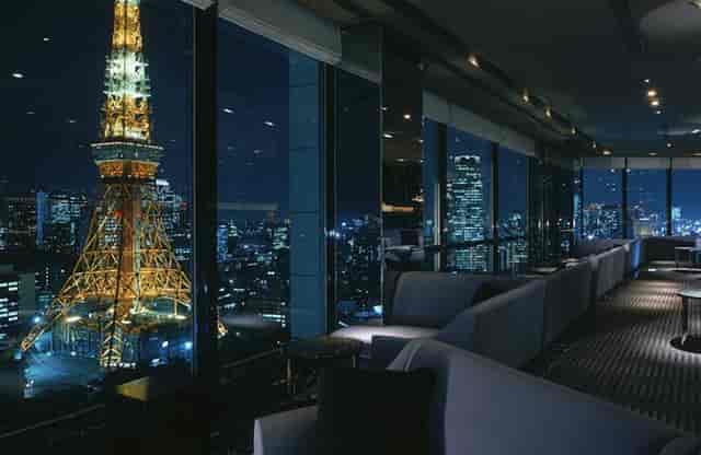 The Prince Park Tower Tokyo suite featuring skyline views for evening receptions and networking.