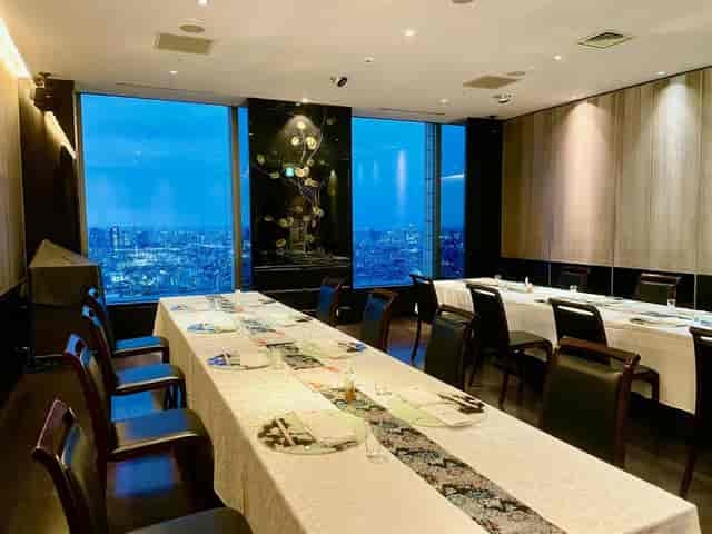 Hokuto private dining room with U-shaped table and city view for executive meetings or VIP dinners.