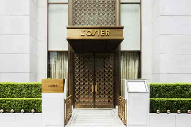 Private salon at L’OSIER, exclusive entrance for VIP dinners and executive meetings.