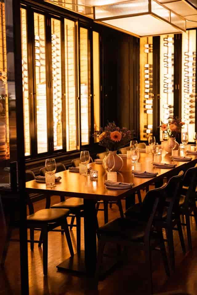 Private dining room at L'ADRESSE with floral decor, perfect for executive dinners and VIP events.