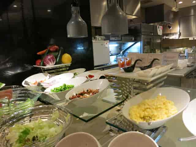 Tiered salad bar at Tokyo Baycourt Club Hotel, professional luxury buffet dining experience.