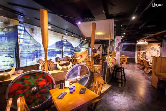 Themed Viking-style event space for immersive dining and corporate breakout sessions.