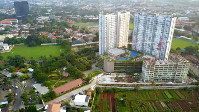 Jaya Real Property: High-density condo site with green space for hotel and conference development.
