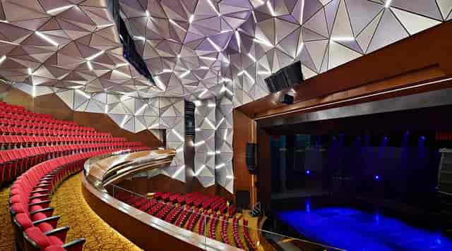 Ciputra Artpreneur Theater with geometric acoustic panels for keynote presentations and stage events.