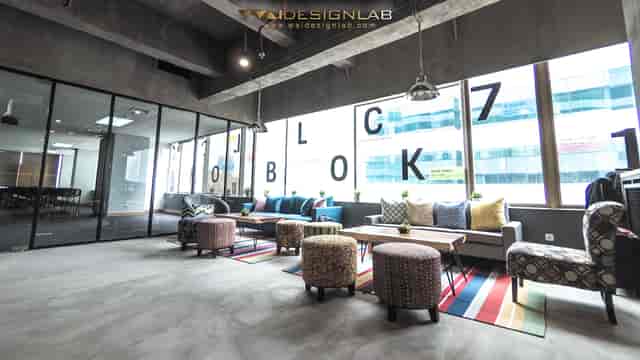 Industrial-chic breakout room at BLOCK71, modular lounge seating for networking and workshops.