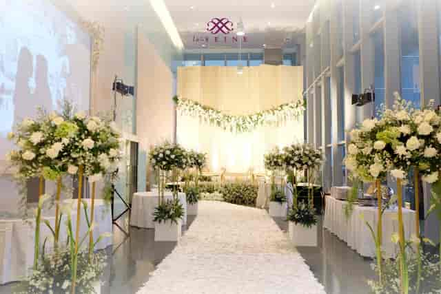 La Seine Hall wedding ceremony with white floral decor and elegant lighting for elegant events.
