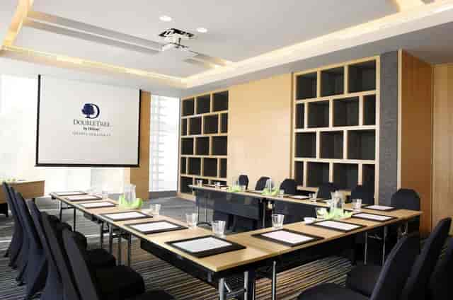 Ebony boardroom at DoubleTree Jakarta with U-shape layout for professional corporate meetings.