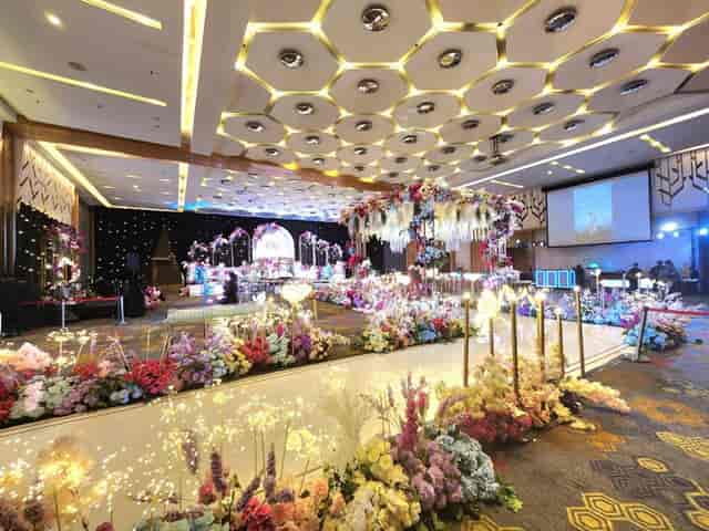 Grand Ballroom wedding runway with floral decor at DoubleTree Jakarta for luxury gala events.