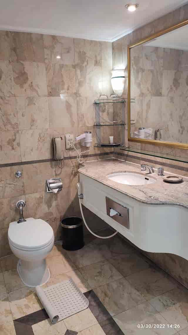 Dated hotel bathroom in Kencana Room, Sari Pacific Jakarta for event site inspections.