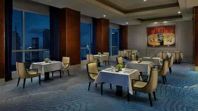 Executive board dining room with skyline view at The Ritz-Carlton Jakarta for corporate events.