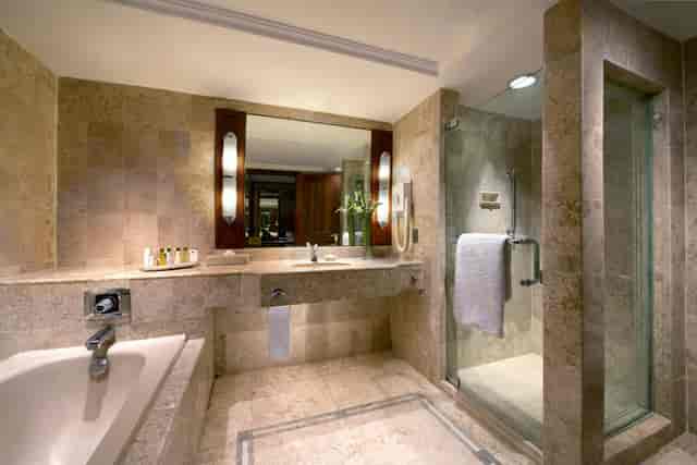 Luxury hotel bathroom in Kudus Garden, Jakarta, featuring a soaking tub for VIP executive stays.