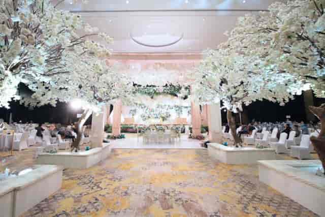 Luxury ballroom with floral installations for high-end weddings and formal gala events.