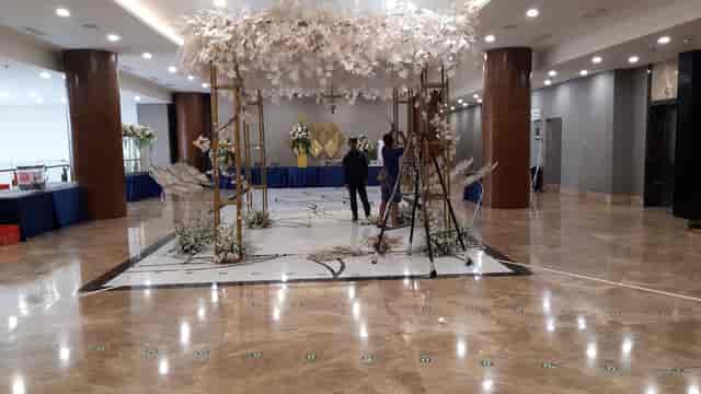 HK Tower wedding ballroom setup with custom floral canopy for luxury event ceremony.