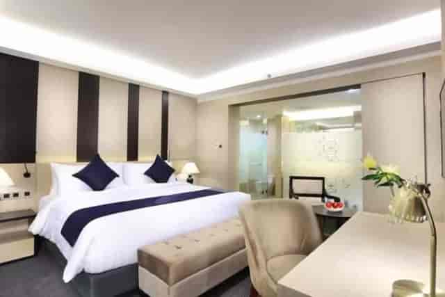 Modern VIP hotel room with workspace for executive business conference and corporate travel.