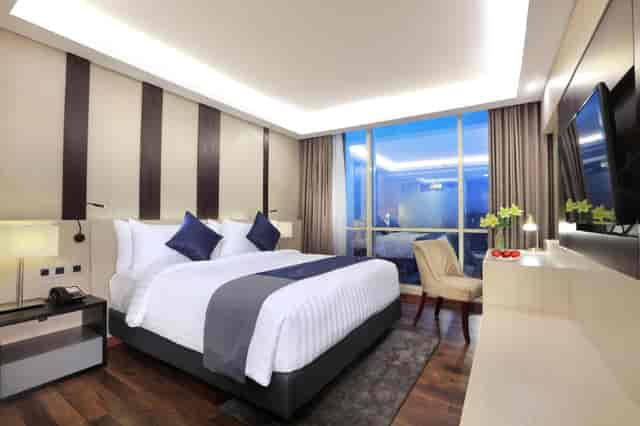 Contemporary hotel room at Aston Kartika Grogol, perfect for corporate conference business travel.