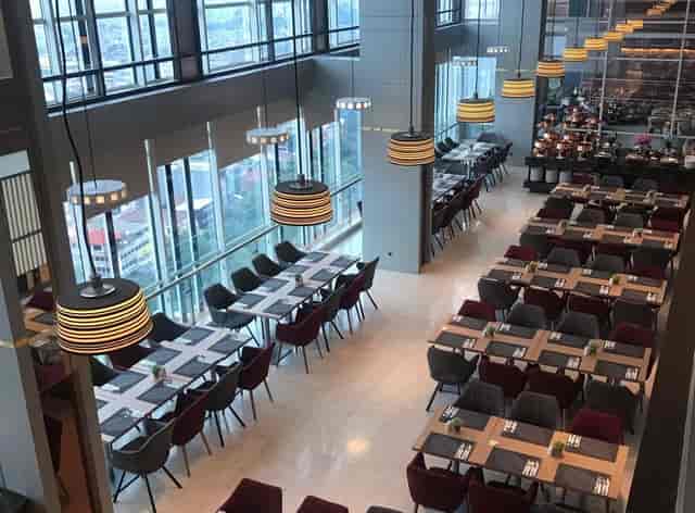 Aston Kartika Grogol hotel restaurant with floor-to-ceiling windows for corporate banquet events.