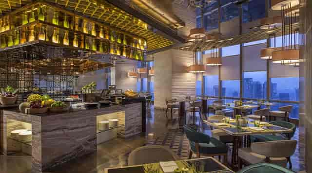 Upscale corporate dinner venue at Seasonal Tastes with skyline views for networking events.
