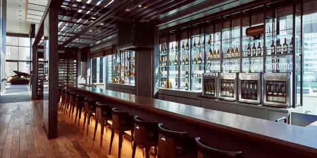 Upscale cocktail reception at The Gate Hotel Tokyo, featuring sleek bar for premium networking.