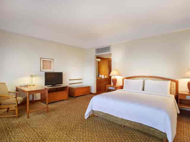 Aryaduta Hotel Menteng suite with workspace for corporate business travel and hotel room blocks.