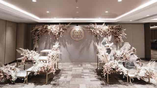 Wedding stage at AYANA Midplaza Jakarta with modern floral decor for elegant ceremony photography.