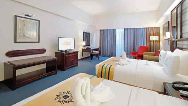 Grand Lake Ballroom hotel room with workspace for corporate travel and conference block bookings.