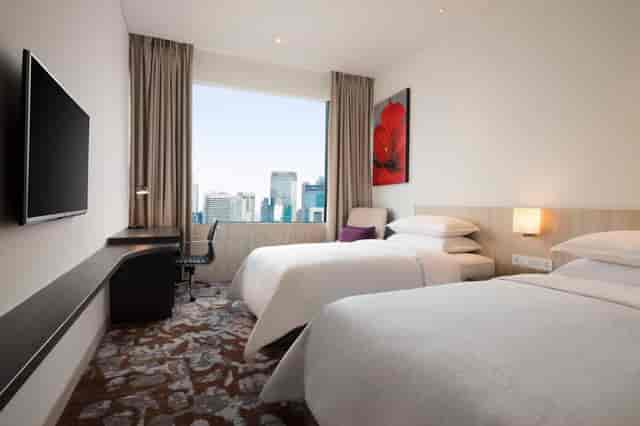 Modern Four Points by Sheraton Jakarta twin room for conference and business event accommodation.