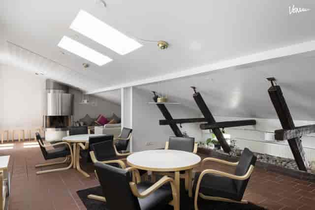 Loft-style event space at Radisson Blu Aleksanteri Hotel with natural light for corporate meetings.