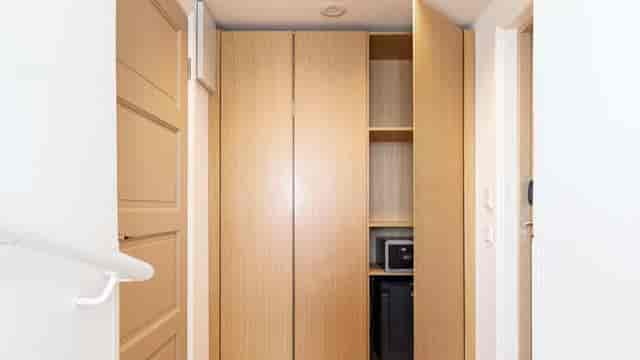 Radisson Blu Aleksanteri meeting room storage with shelving for event delegate amenities.